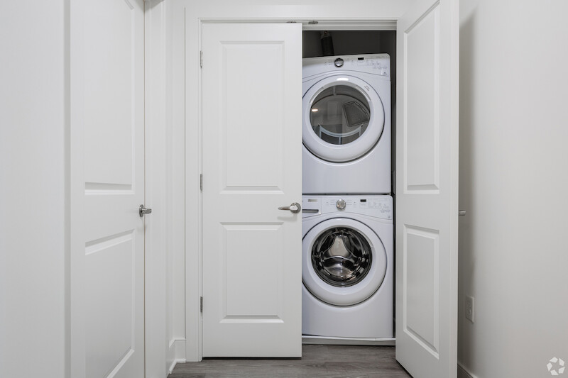 In-unit stacked washer and dryer