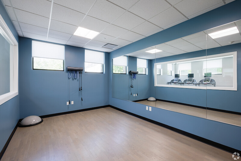 Yoga and wellness studio with mirrored wall