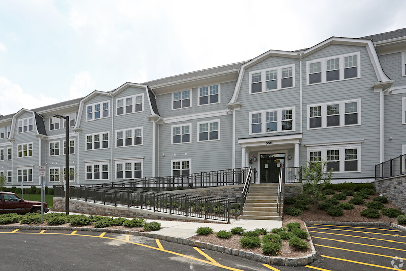 556 building exterior with accessible ramp and parking